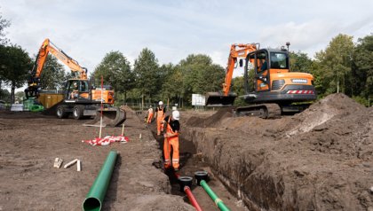 Excavators and people on site during ground work