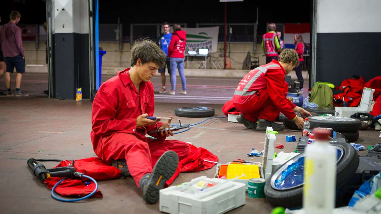Students working in the garage